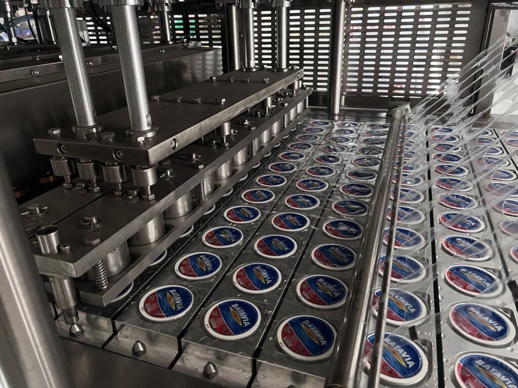 Close-up of the stainless steel components of a filling machine