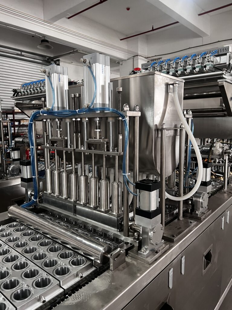 Industrial filling machine with stainless steel components