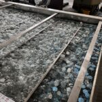 Water-filled tank with floating bottles inside