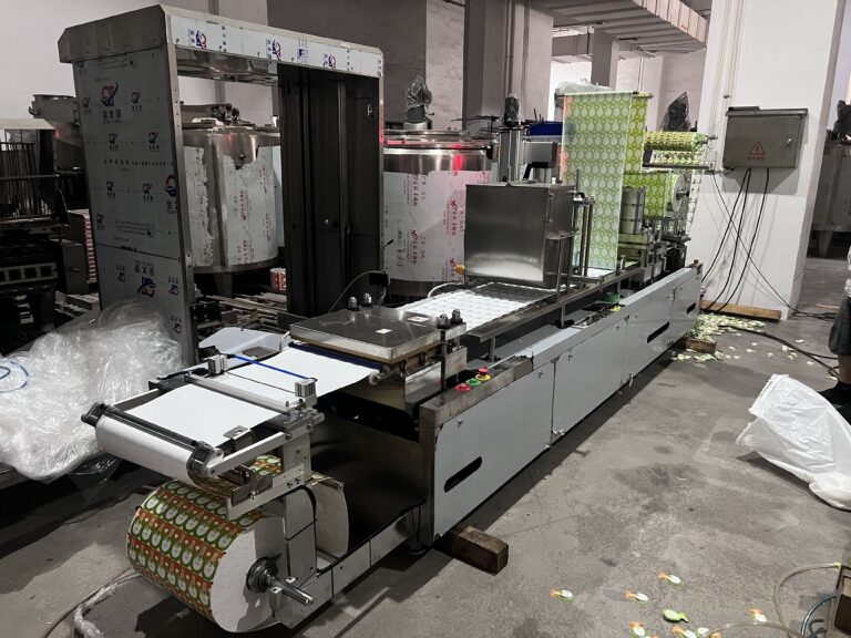 Industrial labeling machine in a production facility.