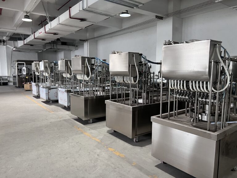 Industrial kitchen with multiple stainless steel machines.