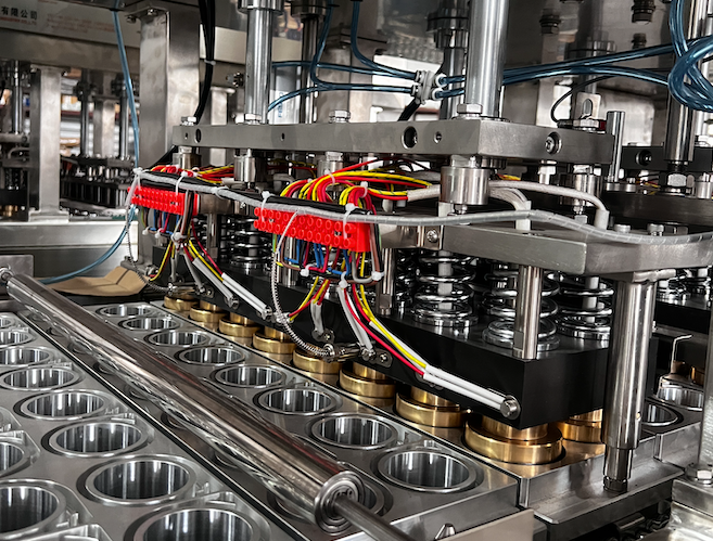 Close-up of intricate machinery with colorful wiring.