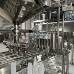 Industrial machinery for bottle filling process.