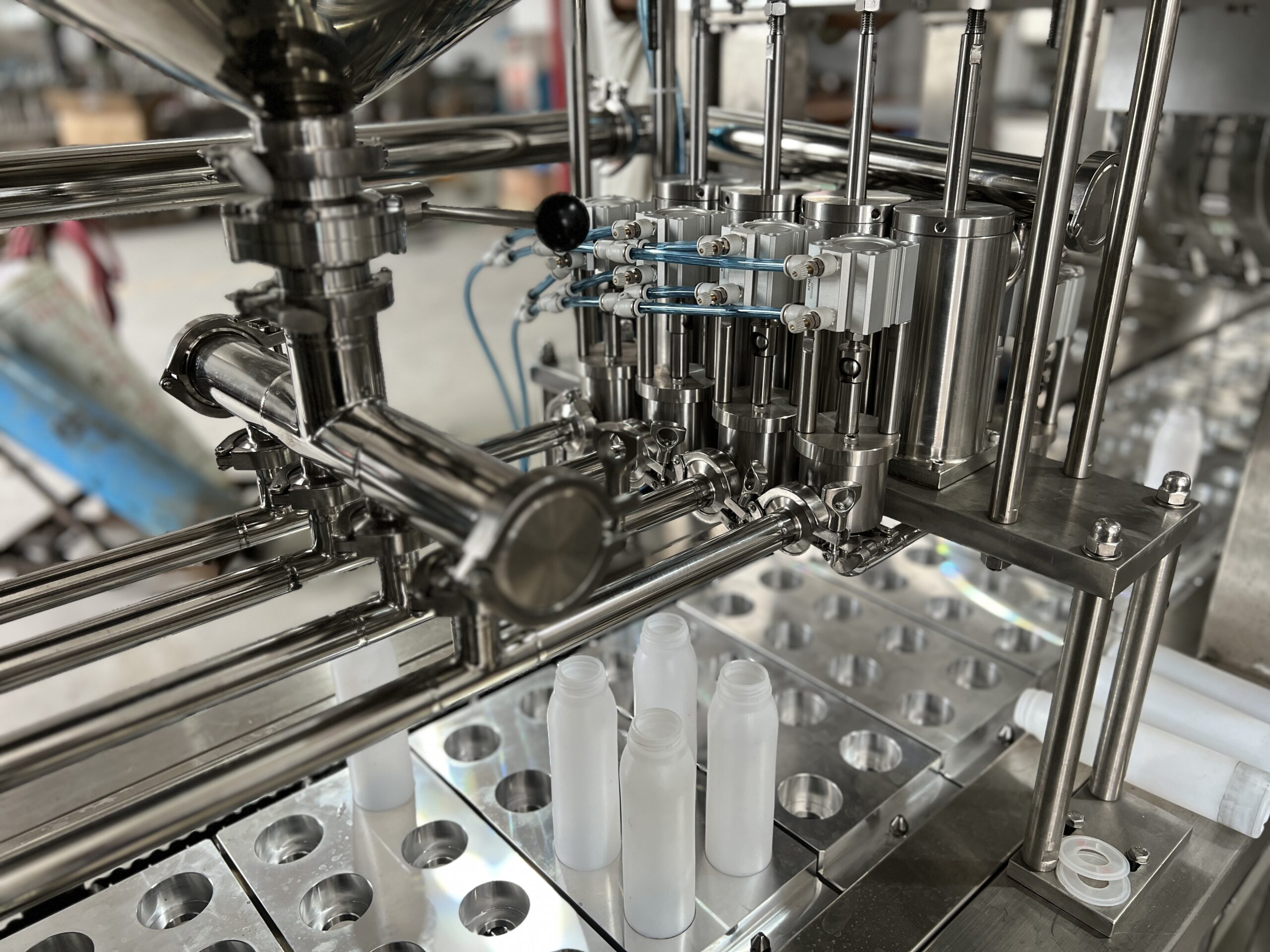 An automated yogurt cup filling and sealing machine in operation