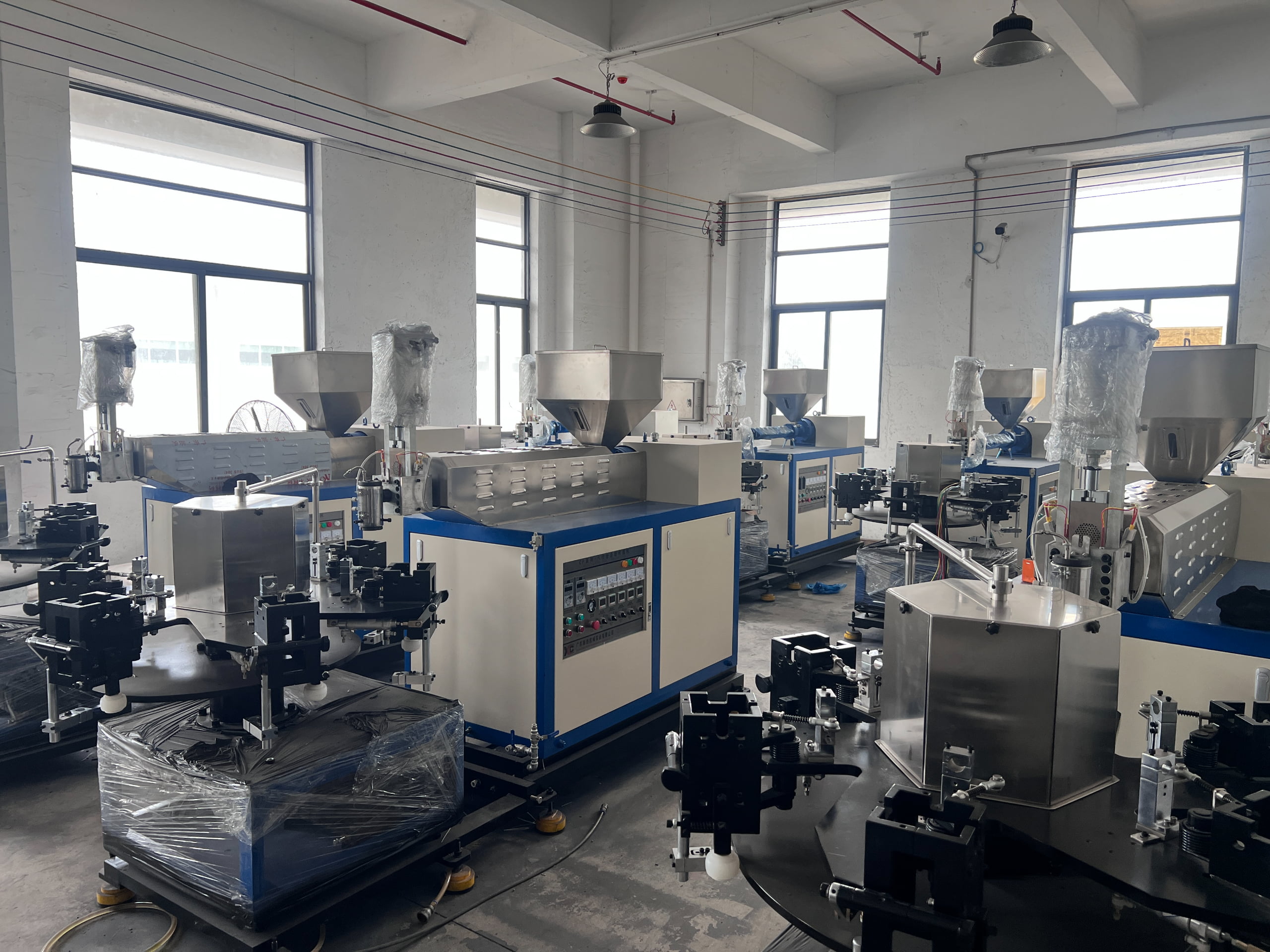 Blowing machine workshop for producing empty ice lolly tubes