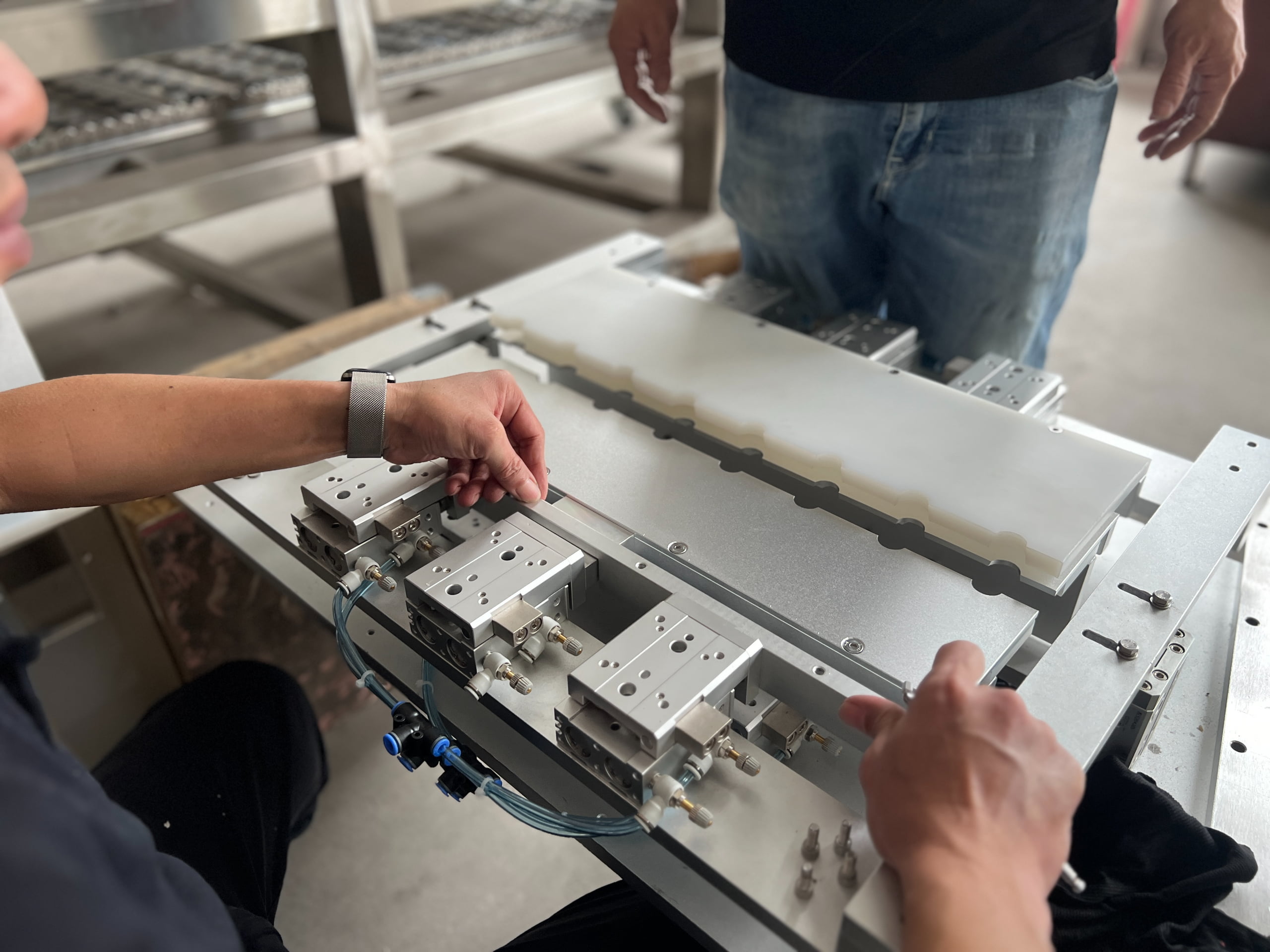 Operator adjusting pouch filling machine conveyor for line layout planning