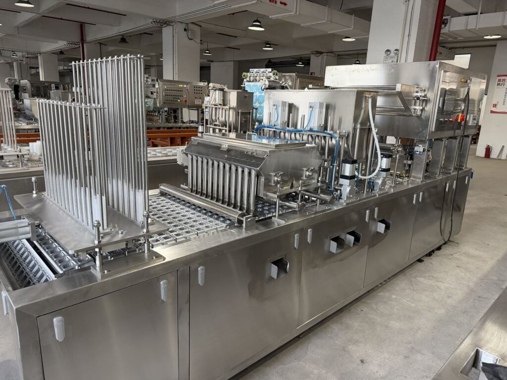 Jelly cup filling and sealing machine overview in factory
