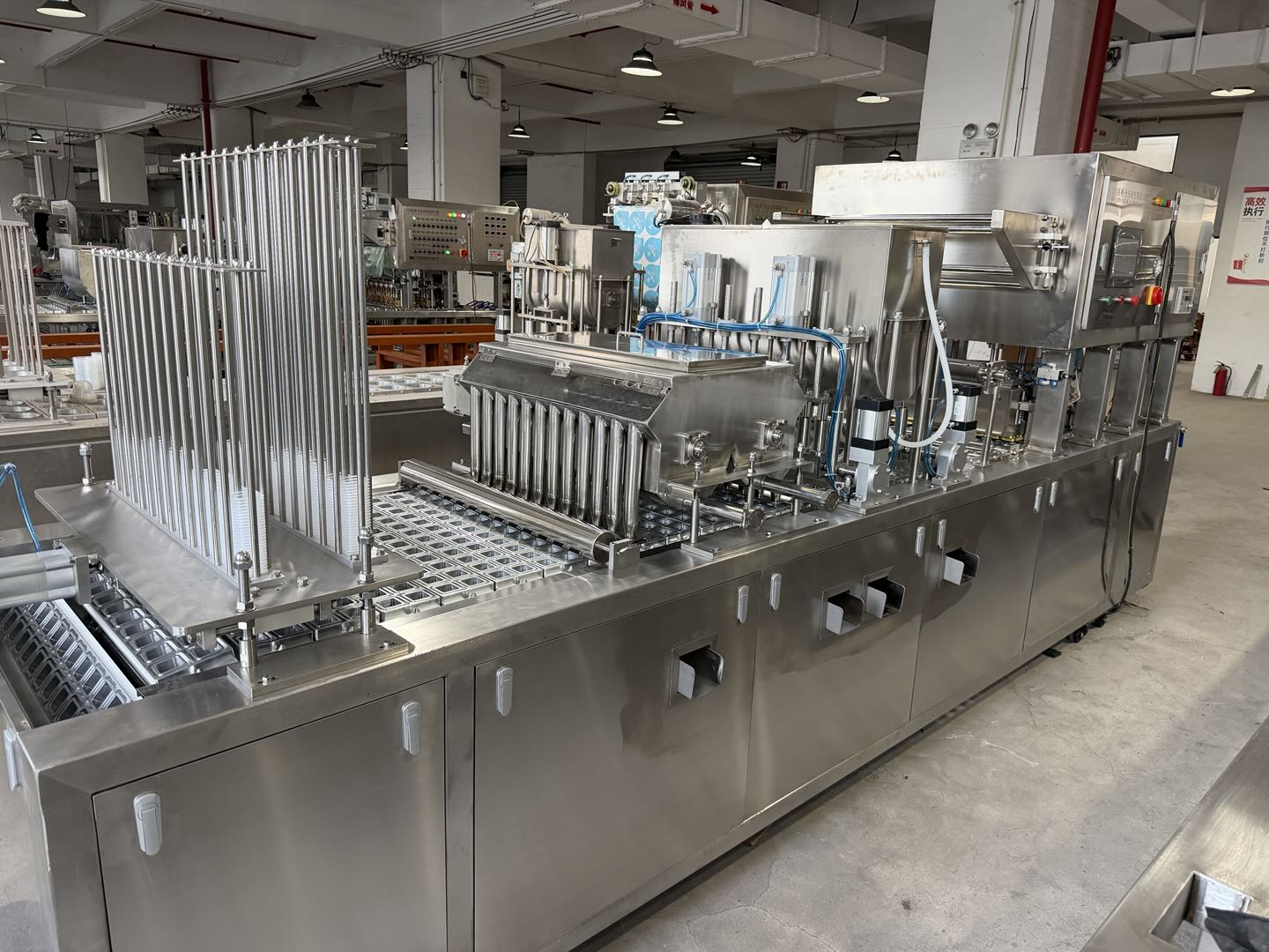 Cup filling and sealing machine overview in factory