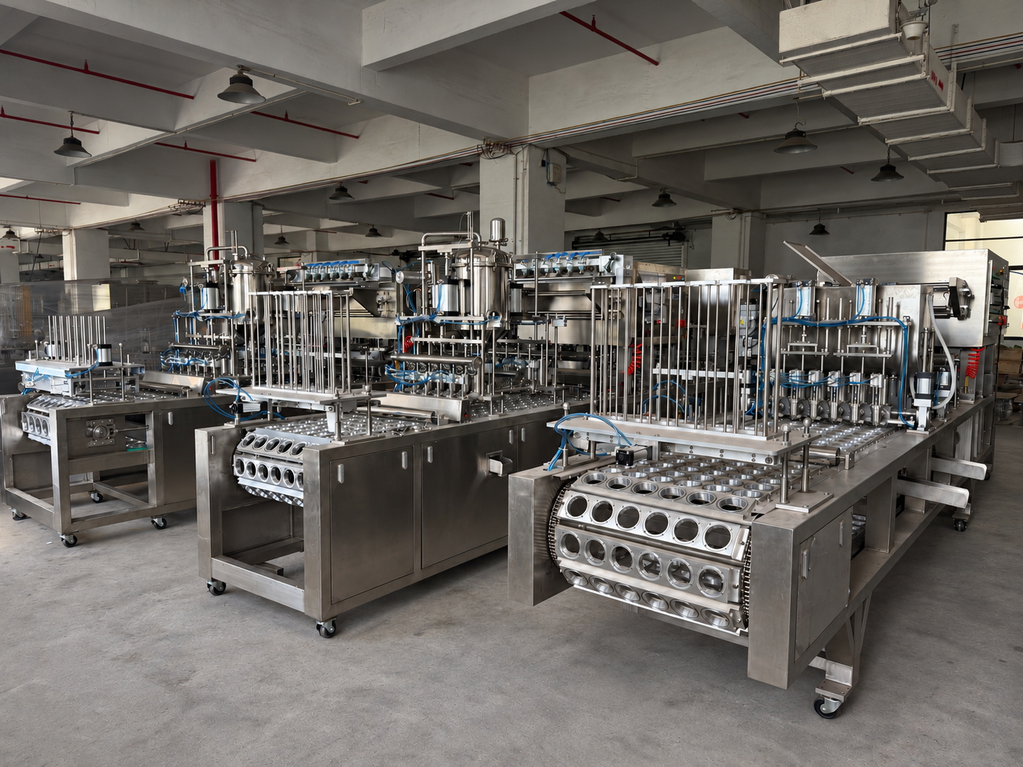 Xinchuang linear cup filling and sealing machines in the workshop