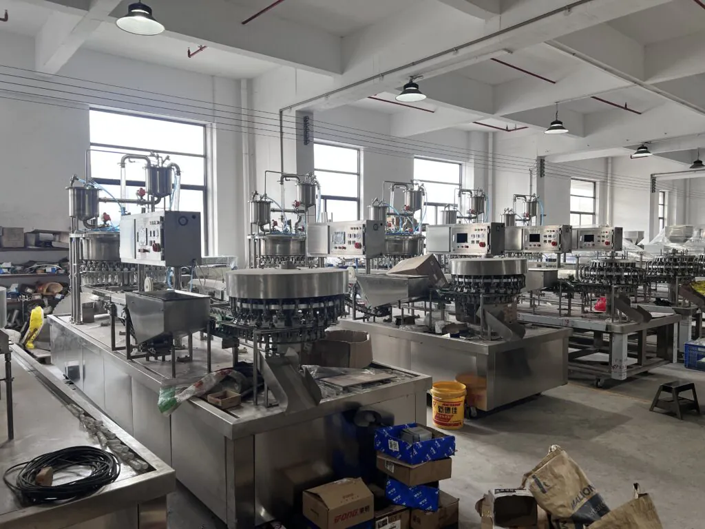 Industrial bottling machines in a factory.