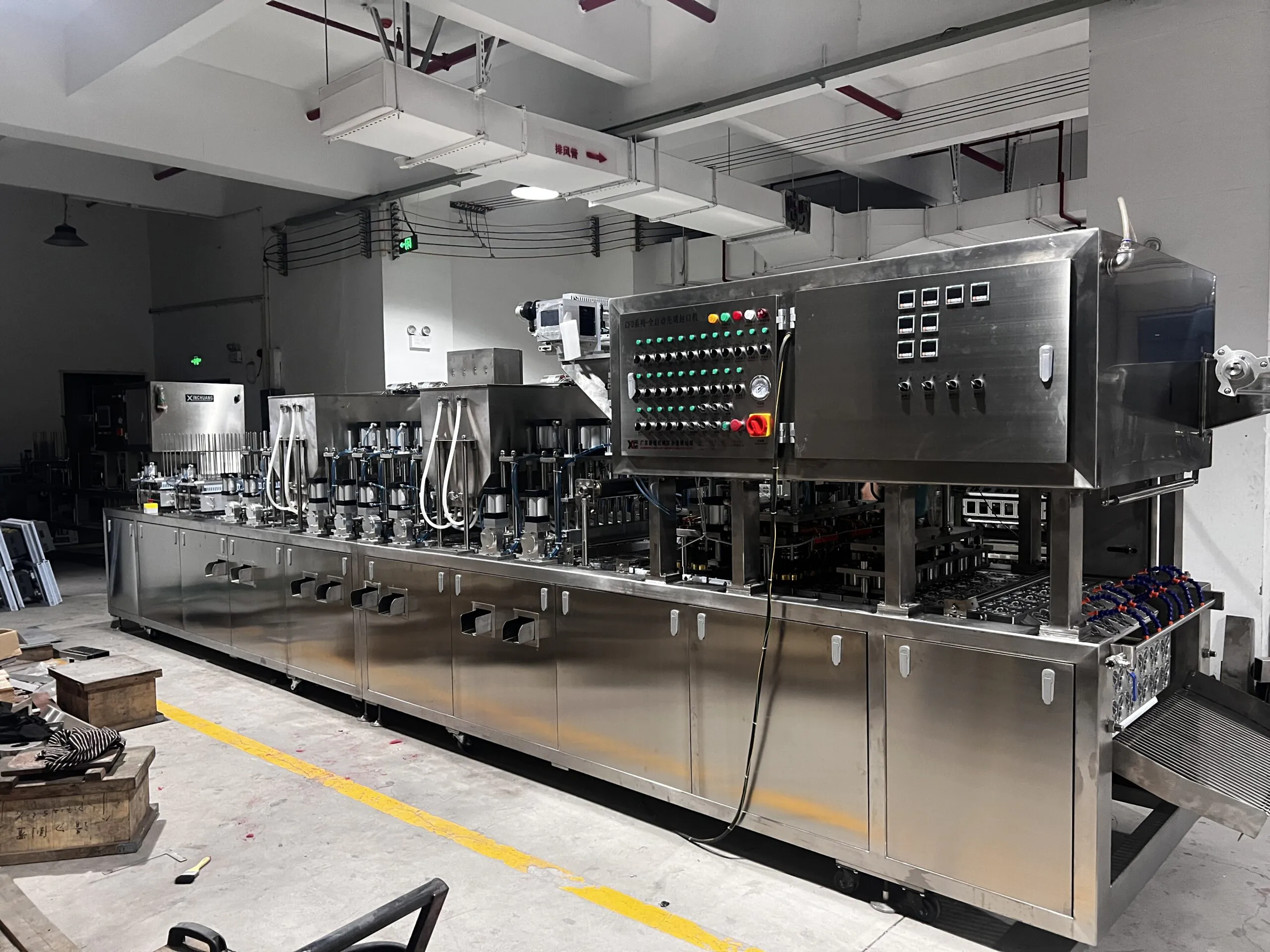 Industrial bottling machine in factory setting