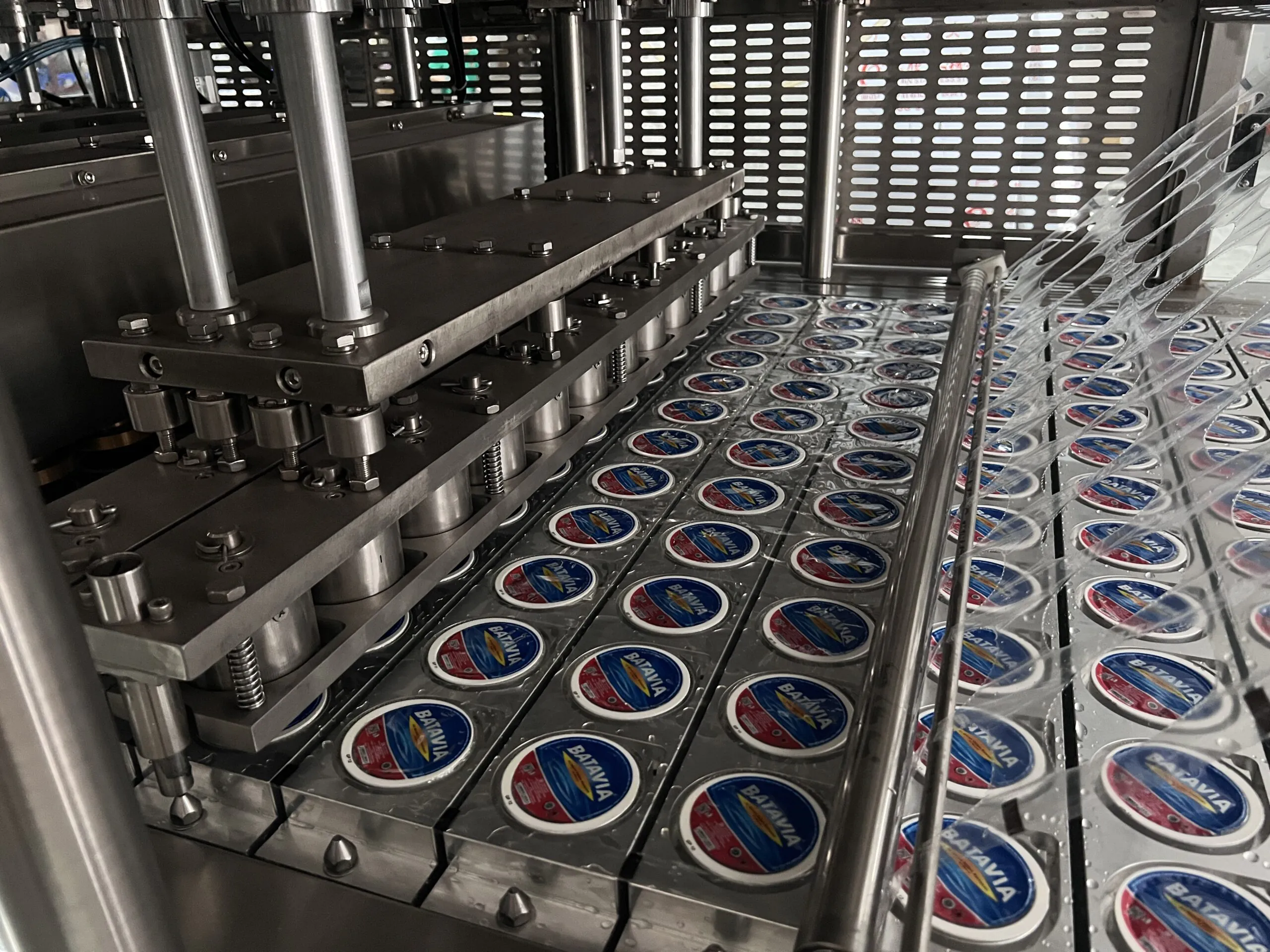 Industrial machinery packaging products efficiently.
