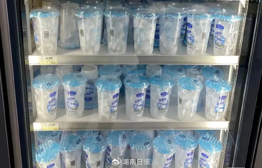 Refrigerator filled with ice-filled plastic cups